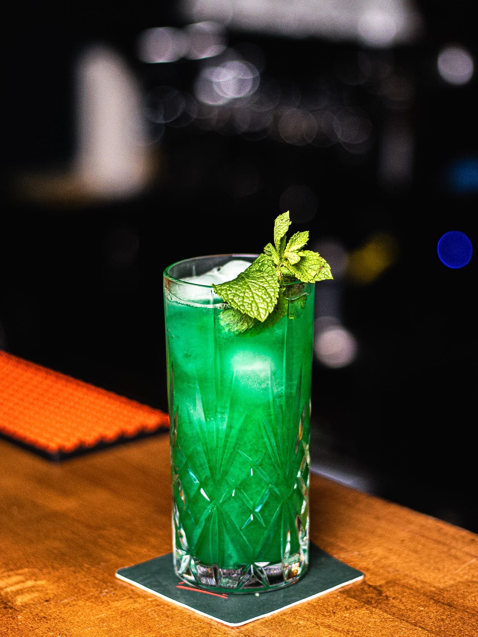 Signature botanical cocktail framed in arched window at Beetroot Berlin